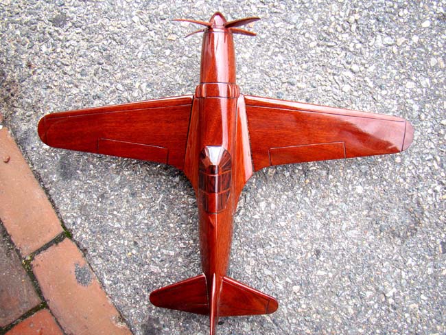 A beautiful carved mahogany depiction of a World War II fighter plane, possibly a Grumman Hellcat F6F — image 3